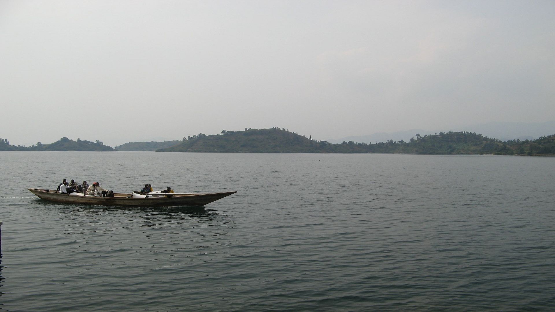 visitors enjoy an evening boat ride at Rwanda's Lake Kivu