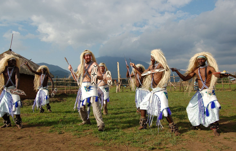 a visitor engages in Iby'wacu cultural dance on the 8 Days Rwanda Gorilla Trek &Wildlife Safari