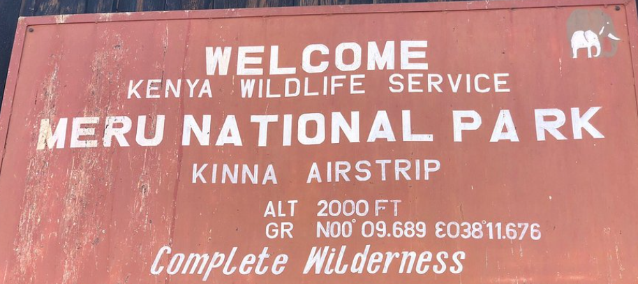 Meru National Park sign post, Kenya, welcoming visitors to explore its untouched wilderness and rich biodiversity.